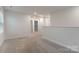 Bonus room featuring neutral paint, carpet, and natural light from a window at 422 Nixon Rd, Belmont, NC 28012