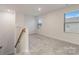 Bonus room featuring neutral paint, carpet, and natural light from two windows at 422 Nixon Rd, Belmont, NC 28012