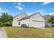 Exterior of the house showcasing the garage door and side yard at 422 Nixon Rd, Belmont, NC 28012