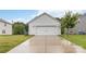 Home's garage featuring a well-maintained driveway at 422 Nixon Rd, Belmont, NC 28012