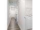 Hallway with doors, wood floors, recessed lighting, and laundry machines in the laundry room at 422 Nixon Rd, Belmont, NC 28012