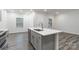 Kitchen with stainless steel appliances, gray cabinets, and kitchen island at 422 Nixon Rd, Belmont, NC 28012