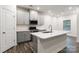 Modern kitchen with gray cabinets, stainless appliances, and kitchen island at 422 Nixon Rd, Belmont, NC 28012