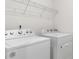 Laundry area showcasing a white washer and dryer at 422 Nixon Rd, Belmont, NC 28012