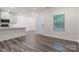 Bright, open-concept living area with vinyl floors and recessed lighting at 422 Nixon Rd, Belmont, NC 28012