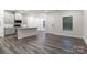 Open-concept living space featuring luxury vinyl plank flooring and stainless appliances at 422 Nixon Rd, Belmont, NC 28012