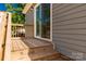 Beautiful rear porch with stylish railing and steps down to the backyard and sliding glass door entrance at 506 Locust St, Rock Hill, SC 29730