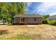 This house features a well-sized backyard with a small deck and patio for entertaining at 506 Locust St, Rock Hill, SC 29730