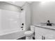 Modern bathroom with granite top vanity, black fixtures, toilet and shower-tub combo at 506 Locust St, Rock Hill, SC 29730