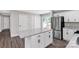 Well-lit kitchen with white cabinets, stainless steel appliances, and center island at 506 Locust St, Rock Hill, SC 29730