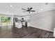 Open-concept kitchen with white cabinetry, stainless steel appliances, and spacious island at 506 Locust St, Rock Hill, SC 29730