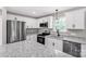 Well-appointed kitchen featuring white cabinets, granite counters, and stainless steel appliances at 506 Locust St, Rock Hill, SC 29730