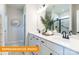 Bright bathroom with double vanity, sleek fixtures, and walk-in shower with glass door at 530 Hullview Vis, Monroe, NC 28110