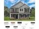 Charming two-story home with a brick foundation, gray siding, and black shutters at 530 Hullview Vis, Monroe, NC 28110