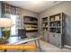 Office with custom desk, shelving and a large window allowing for ample natural light at 530 Hullview Vis, Monroe, NC 28110