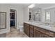 Bathroom boasts double sinks, granite countertop, and a view into the walk-in closet at 5668 Stanfield Ridge Dr, Stanfield, NC 28163