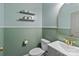A view of the half bathroom with updated fixtures and finishes with decorative wallpaper at 5668 Stanfield Ridge Dr, Stanfield, NC 28163