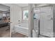 Bathroom view featuring a soaking tub and separate glass door shower with neutral wall color at 5668 Stanfield Ridge Dr, Stanfield, NC 28163