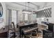A cozy dining room featuring a stylish rug, a modern light fixture, and decor accents at 5668 Stanfield Ridge Dr, Stanfield, NC 28163
