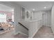 Hallway leading to bedroom with carpet flooring and decorative wall art at 5668 Stanfield Ridge Dr, Stanfield, NC 28163