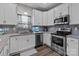 Close-up of a kitchen featuring stainless steel appliances, granite countertops, and lots of cabinetry at 5668 Stanfield Ridge Dr, Stanfield, NC 28163
