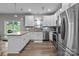 A kitchen featuring stainless steel appliances, a granite countertop, and bright, white cabinetry at 5668 Stanfield Ridge Dr, Stanfield, NC 28163