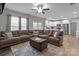 Spacious living room that flows into kitchen with a large sectional sofa and plenty of seating at 5668 Stanfield Ridge Dr, Stanfield, NC 28163