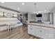 Open-concept living room and kitchen with granite counters, stainless appliances, and hardwood flooring at 5668 Stanfield Ridge Dr, Stanfield, NC 28163