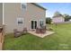 Private patio with outdoor seating and a grill, ideal for dining and relaxation at 5668 Stanfield Ridge Dr, Stanfield, NC 28163
