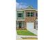 Charming townhouse with a brick and siding facade, a one car garage, and a neatly manicured front lawn at 6013 Jasmine Branch Rd, Charlotte, NC 28216