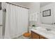 Clean bathroom with a shower, toilet, vanity, and decorative details at 626 Trail Ridge Rd, Matthews, NC 28105