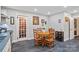 Warm kitchen with a round dining table, complemented by a glass-paned door and elegant decor at 626 Trail Ridge Rd, Matthews, NC 28105