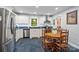 Bright kitchen features stainless steel appliances, a window over the sink, and a cozy dining area with a wooden table at 626 Trail Ridge Rd, Matthews, NC 28105