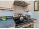 Close-up of a stainless steel stove top with white subway tile backsplash and sleek countertops in a modern kitchen at 626 Trail Ridge Rd, Matthews, NC 28105