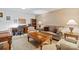 Cozy living room and office area featuring comfortable seating, and hardwood coffee table at 626 Trail Ridge Rd, Matthews, NC 28105