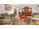 Elegant living room featuring plush sofas, a decorative rug, and a wooden coffee table at 626 Trail Ridge Rd, Matthews, NC 28105