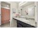 Modern bathroom with granite countertops, dark cabinetry, a large mirror, and a shower with a patterned curtain at 6510 Nathan Dr # 78, Charlotte, NC 28269