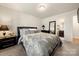Well-lit bedroom with a cozy bed, a bedside table, and ample closet space, creating a comfortable and functional space at 6510 Nathan Dr # 78, Charlotte, NC 28269