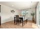 Bright dining room featuring large windows and an elegant table setting for six at 6510 Nathan Dr # 78, Charlotte, NC 28269