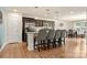 This spacious kitchen features dark cabinets, stainless steel appliances, an island, and an adjacent dining area at 6510 Nathan Dr # 78, Charlotte, NC 28269