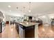 Modern kitchen with an island, stainless steel appliances, and a view of the living area at 6510 Nathan Dr # 78, Charlotte, NC 28269