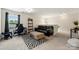 Spacious living room with contemporary furnishings, natural light, and neutral tones to create a welcoming atmosphere at 6510 Nathan Dr # 78, Charlotte, NC 28269