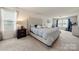 Comfortable main bedroom featuring a plush bed, ample natural light, and a cozy sitting area, creating a relaxing retreat at 6510 Nathan Dr # 78, Charlotte, NC 28269