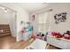 This playroom showcases an organized and playful space with toys, a small desk, and natural light at 6510 Nathan Dr # 78, Charlotte, NC 28269