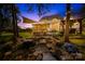 Inviting back porch with fireplace and water feature at 738 Rocky Hollow Trl, Clover, SC 29710