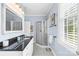 Bright bathroom with black and white tile floor, vanity with mirror, and glass shower at 738 Rocky Hollow Trl, Clover, SC 29710