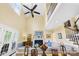 Bright living room with vaulted ceiling, fireplace, ceiling fan, and staircase to second floor at 738 Rocky Hollow Trl, Clover, SC 29710