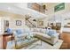 Spacious living room with high ceilings, comfortable seating, and views of the staircase and kitchen area at 738 Rocky Hollow Trl, Clover, SC 29710