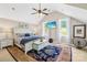 Bright main bedroom with vaulted ceilings, ceiling fan, and large windows overlooking the yard at 738 Rocky Hollow Trl, Clover, SC 29710