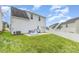 View of backyard with green grass and a concrete patio at 8005 Stevie Oaks Ln, Charlotte, NC 28215
